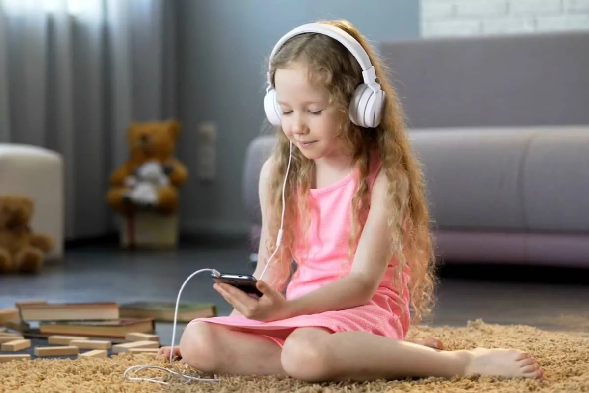 child listening to music